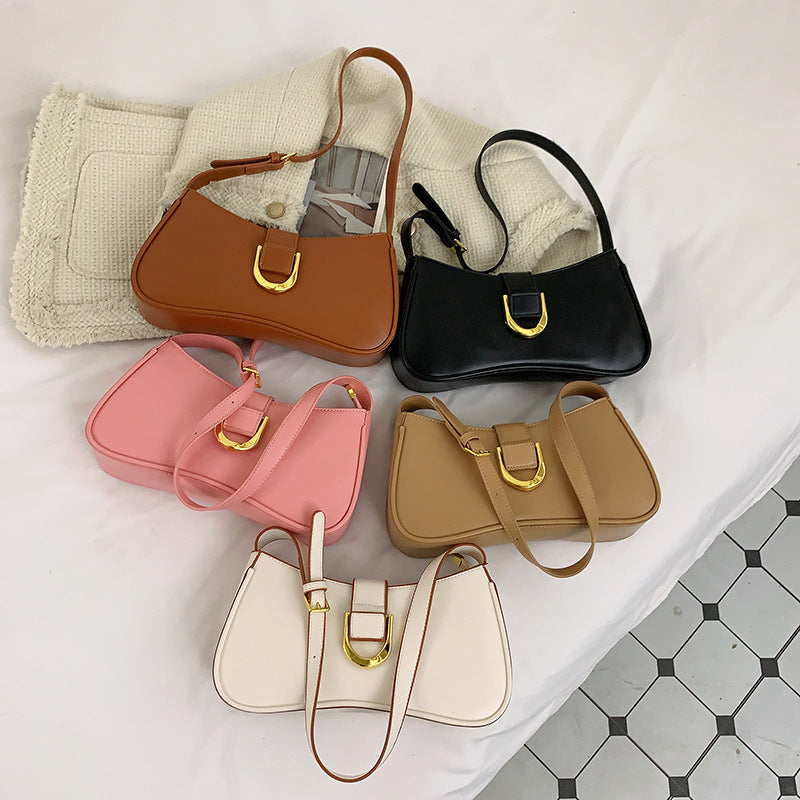 Petit sac à main femme trapèze, les cinq coloris camel, noir, rose, beige et blanc posés côte à côte